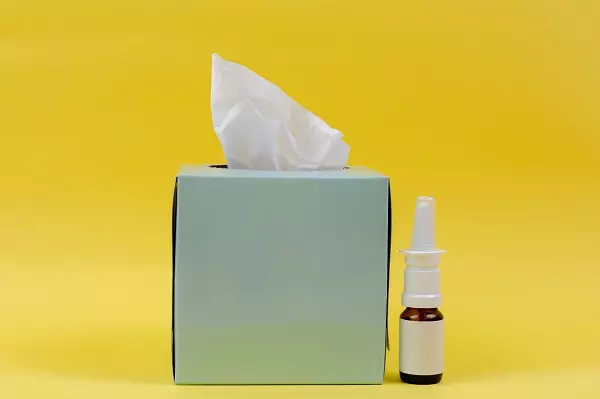 Allergy Prescription Nasal Spray and Box of Tissues