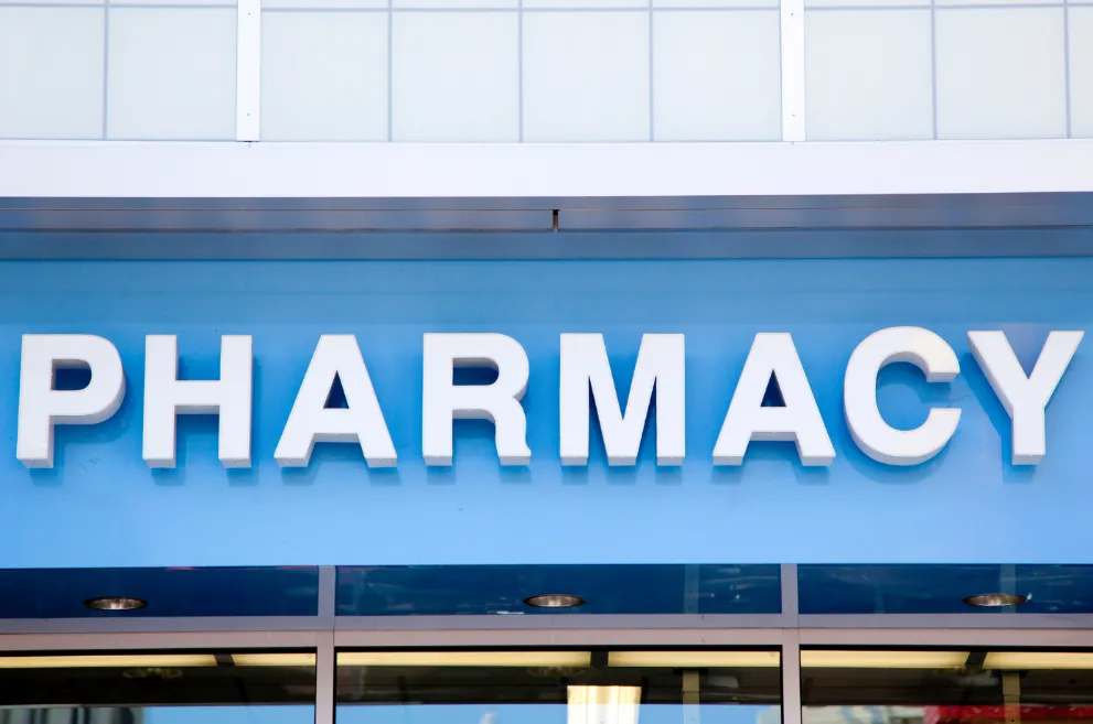 Blue and white pharmacy sign