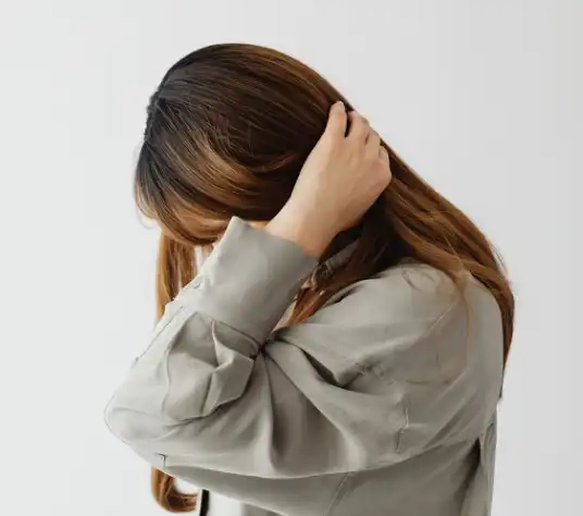 Brown Haired Woman with Head Down