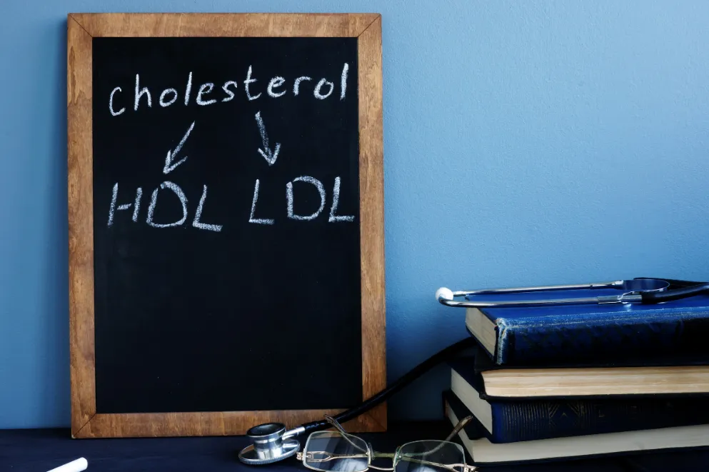 Cholesterol HDL LDL written on a blackboard.