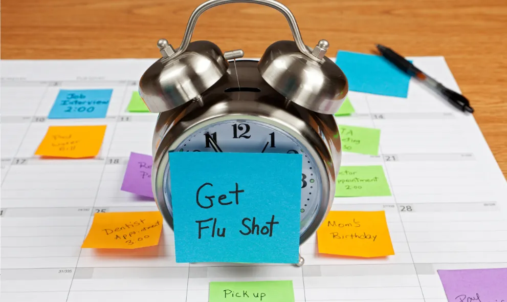 Clock and stickynote reminders to get flu shot