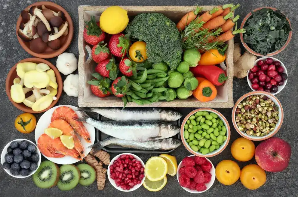 Colorful foods in containers on dark background