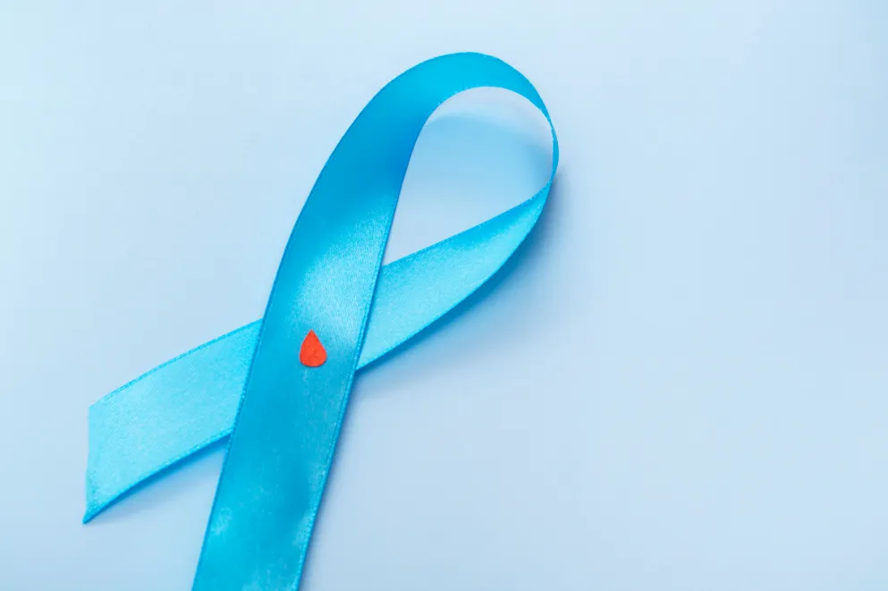 Diabetes awareness ribbon on blue background