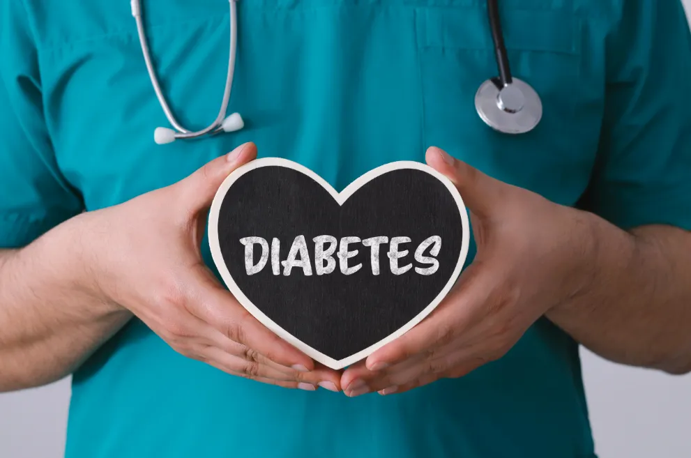 Doctor holding heart-shaped sign with word Diabetes