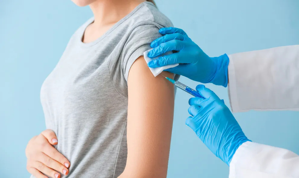 Doctor vaccinating pregnant woman