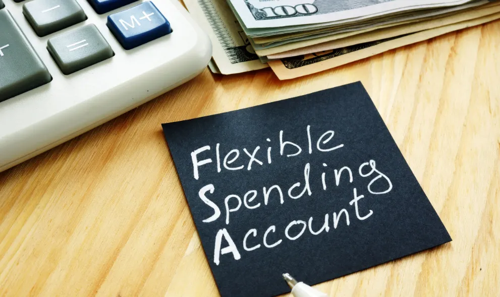 Flexible Spending Account FSA sign with money and calculator