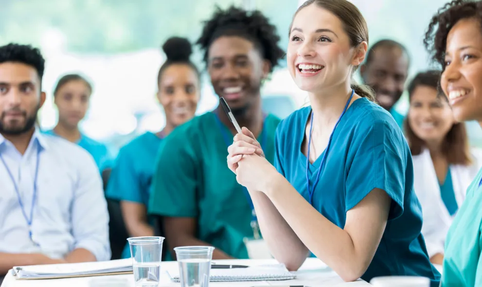 Happy and attentive nursing students in class