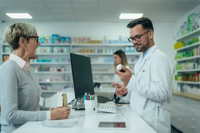 Happy patient being helped by pharmacist