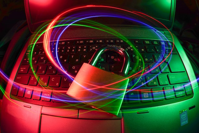 Laptop and lock with swirling colored lights