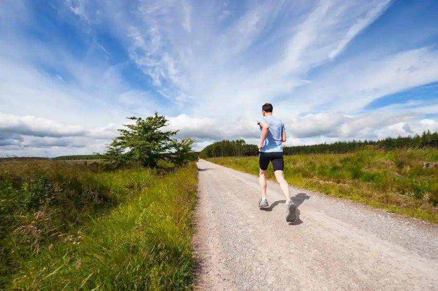 Man running up a lane