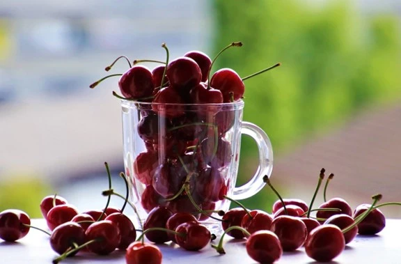 Multiple cherries in a glass