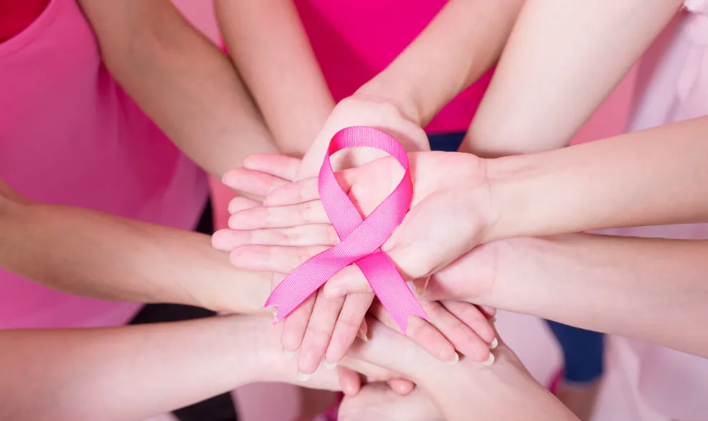 Multiple hands holding pick ribbon
