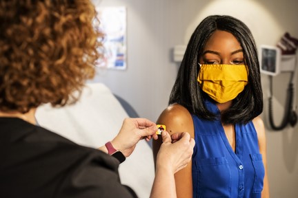 Woman getting vaccinated