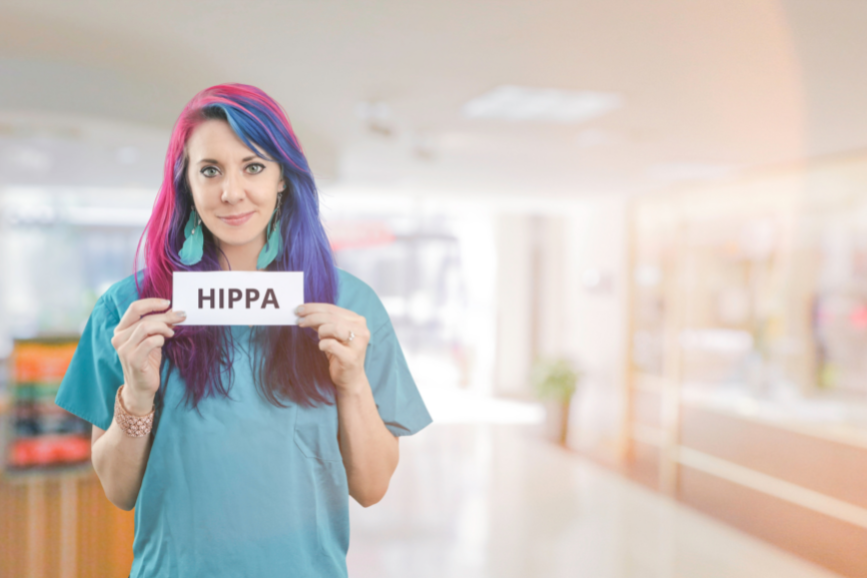 Nurse holding HIPPA sign