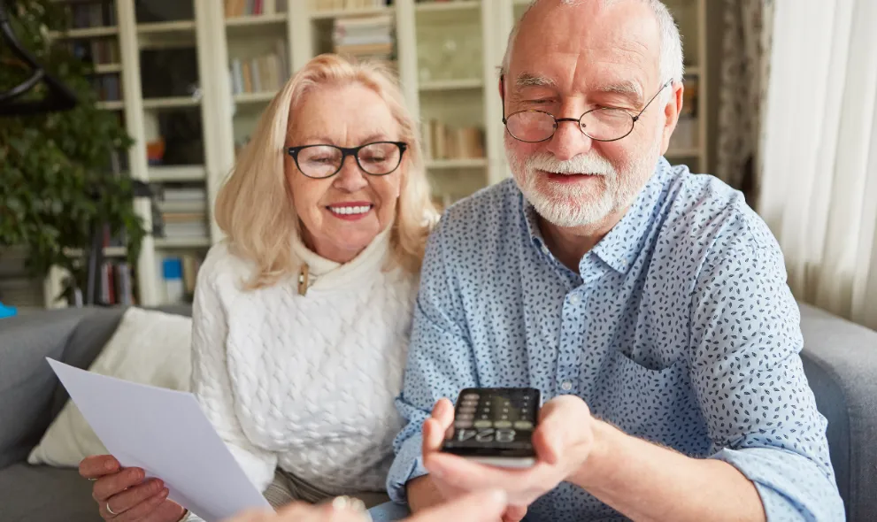 Older couple happy with savings displayed