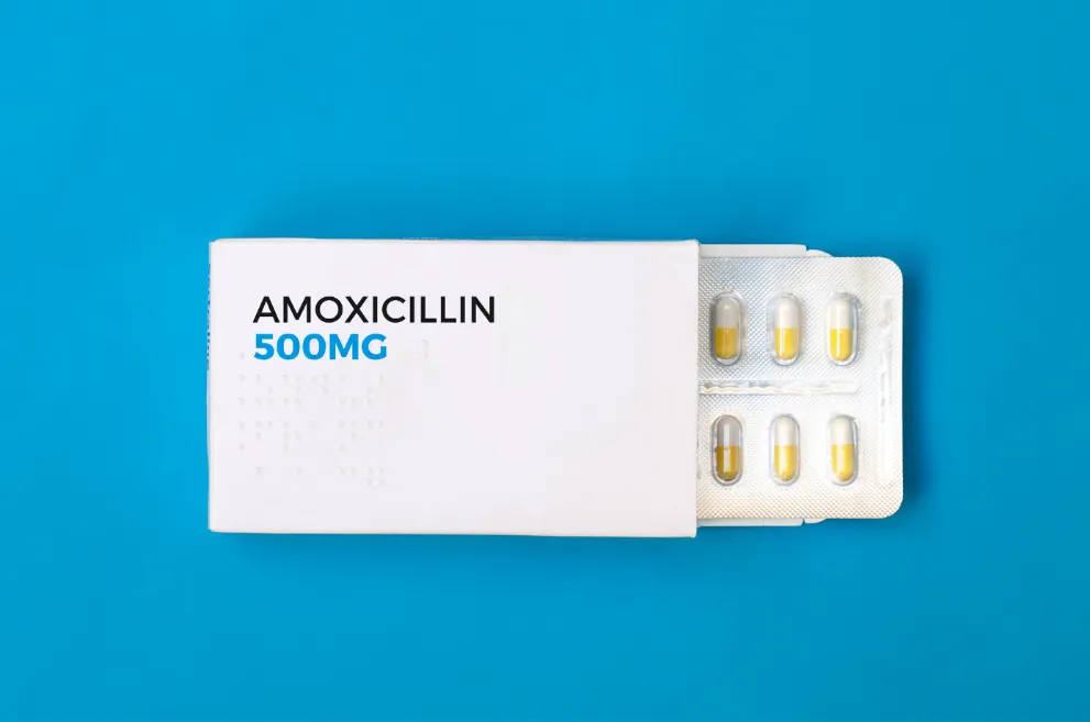 Package of amoxicillin on blue background