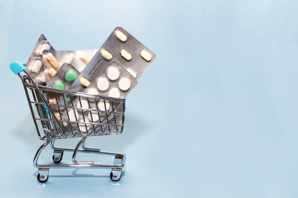 Packs of pills in tiny shopping cart