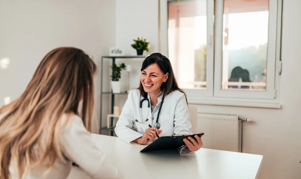 Patient and doctor talking in doctors office