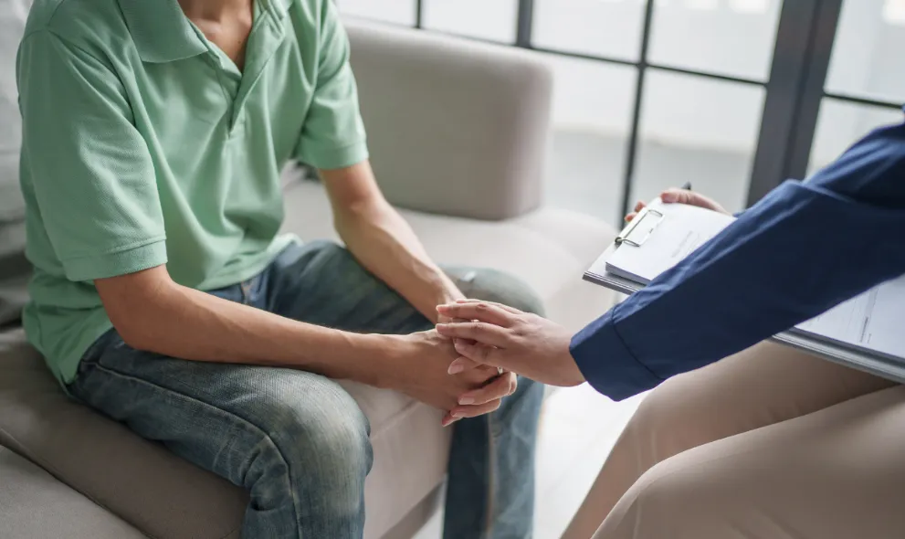 Patient discussing mental health issues with doctor