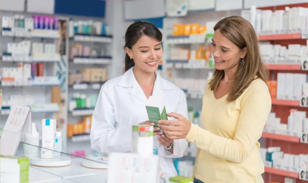 Patient talking to pharmacist about product