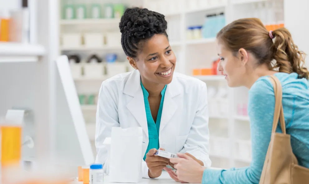 Pharmacist consults with patient