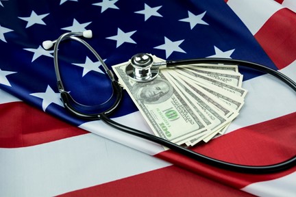 American flag with stethoscope and hundred dollar bills