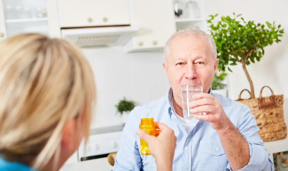 Senior man taking cholesterol medications