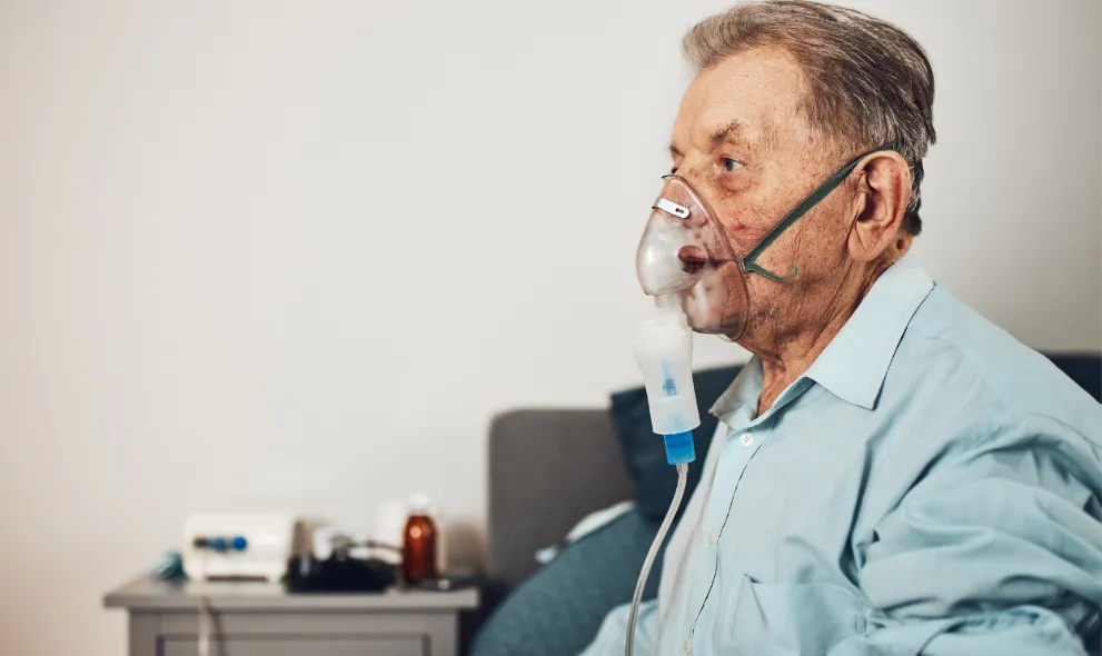 Senior man using a nebulizer