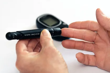 Person doing glucose level blood test