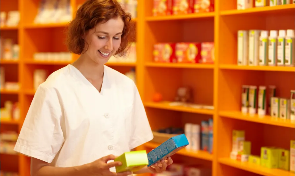 Smiling woman comparing two medications