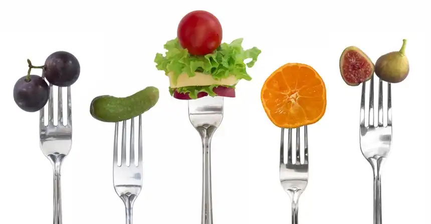 Different foods on forks