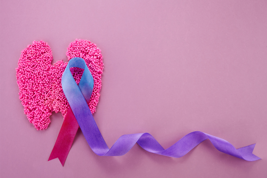 Thyroid awareness ribbon over thyroid shape