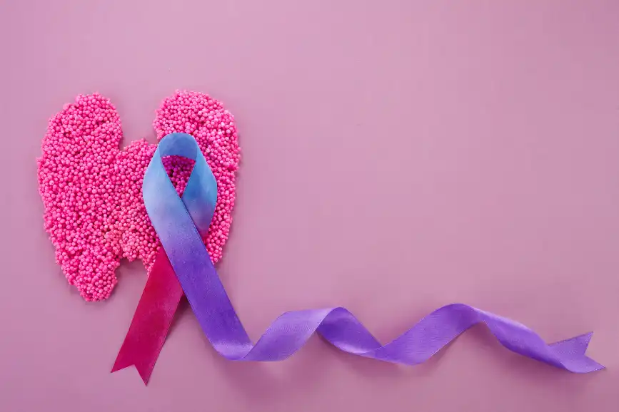 Thyroid awareness ribbon over thyroid shape