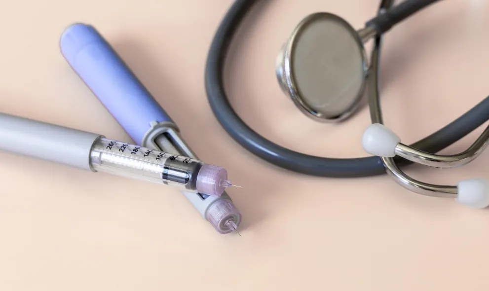 Two insulin injector pens for diabetes with stethoscope