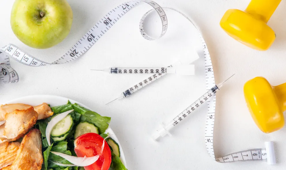 Weight loss injections with salad weights and tape measure