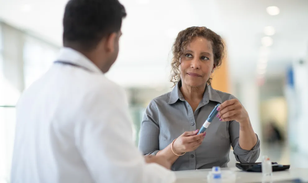 Woman discussing possible prediabetes with doctor