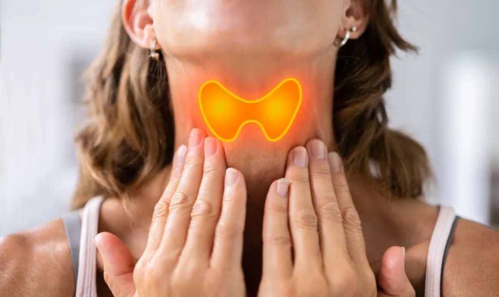 Woman highlighting thyroid gland