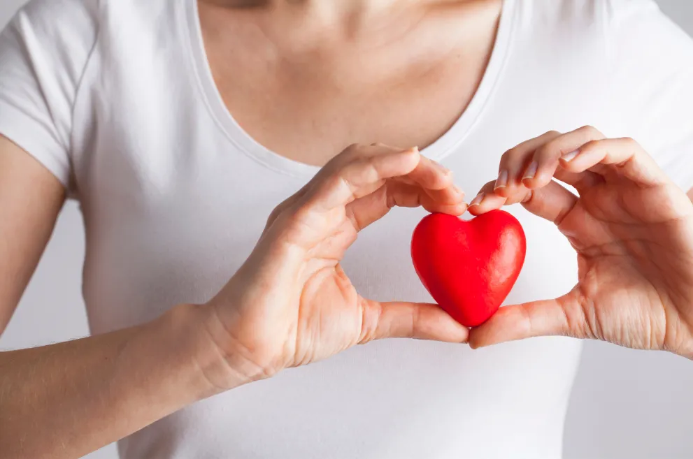 Woman holding heart