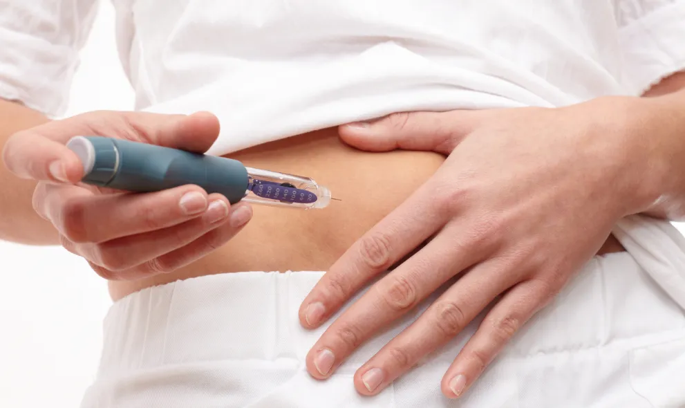 Woman injecting herself with a GLP