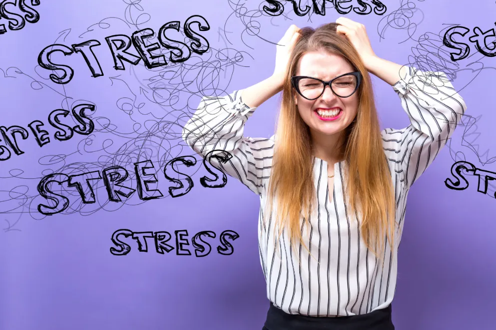 Woman Looking Overwhelmed with Word Stress Scribbled Around Her