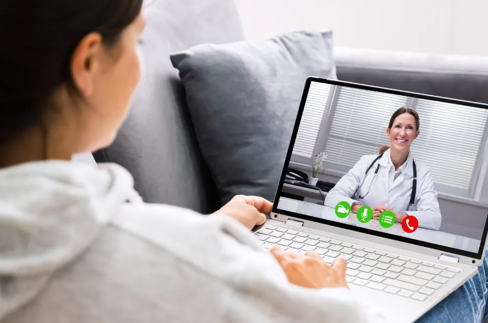 Woman on laptop in virtual doctor visit