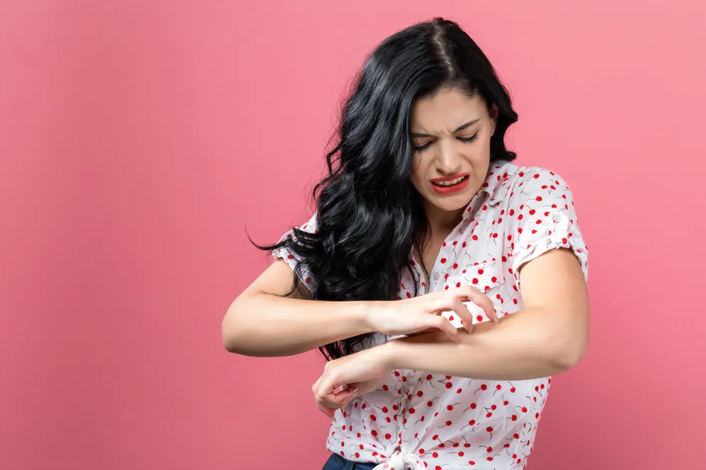 Woman Scratching an Itch on Pink Background