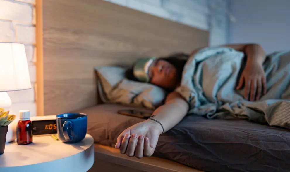 Woman sleeping with mask using sleeping pills