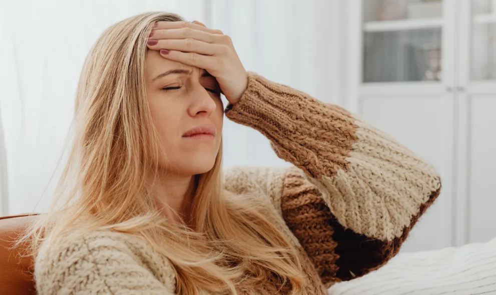 Woman suffering from migraine