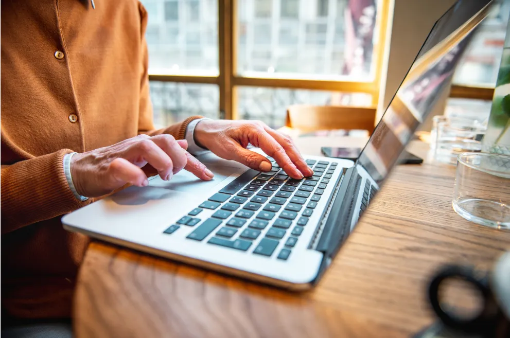 Woman using laptop at table