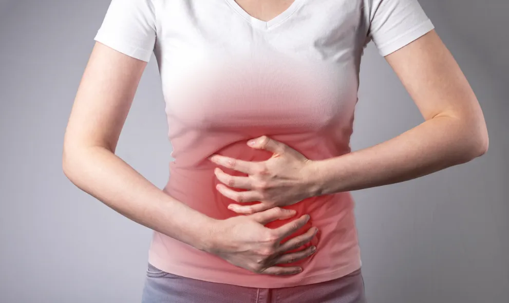 Womans hands on painful stomach
