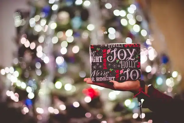 Wrapped present with blurred lights in background